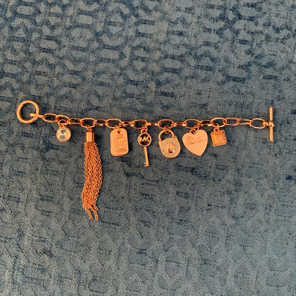 Michael kors toggle charm bracelet. Pinkish rose color. Perfect gift.